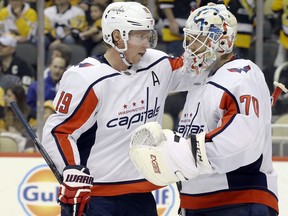 Washington Capitals centre Nicklas Backstrom, left, and goaltender Braden Holtby celebrate after defeating the Pittsburgh Penguins at PPG PAINTS Arena in Pittsburgh, May 7, 2020. (Charles LeClaire-USA TODAY Sports)