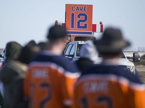 Well wishers gathered along Hwy. 16 on April 13, 2020, to show support for the family of Edmonton Oilers forward Colby Cave, who died after suffering a brain bleed.