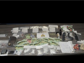 Vegreville RCMP have seized what is believed to be 254 grams of crystal methamphetamine, 12 grams of cocaine, psilocybin (mushrooms) and approximately $2,500 in cash along with knives and ammunition. (Supplied photo/RCMP)