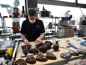 Jerome Grimonpon makes chocolate for Easter during the coronavirus lockdown imposed by the Belgian government in an attempt to slow down the coronavirus disease in Brussels. (REUTERS/Johanna Geron)