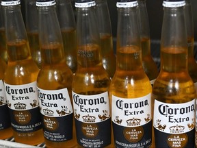 This file photo taken on June 4, 2019 shows bottles of Mexican beer Corona at a market, in Mexico City. (RODRIGO ARANGUA/AFP via Getty Images)