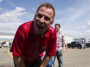 Bob Paterson, director of advertising, does the ALS Ice Bucket Challenge outside the Edmonton Sun office on Aug. 22, 2014.