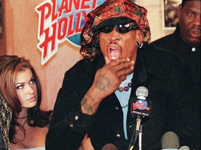 Former Chicago Bulls star Dennis Rodman speaks at a press conference in Beverly Hills accompanied by his wife Carmen Electra in this file photo.