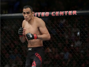 Tony Ferguson (red gloves) before fighting Donald Cerrone (blue gloves) during UFC 238 at United Center.