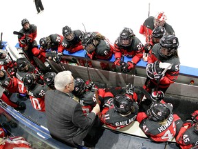 Team Canada players listen as coach Perry Pearn gives directions at the National Women's Team Rivalry Series in London, Ont., on Feb. 12, 2019.