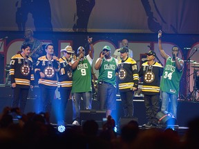 Boyz II Men perform with New Kids on the Block during the Boston Strong: An Evening Of Support And Celebration at TD Garden on May 30, 2013, in Boston.