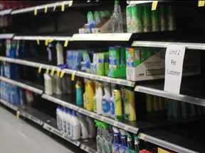 Shelves, normally full of cleaning products like Lysol, are pictured quite bare in this file photo.