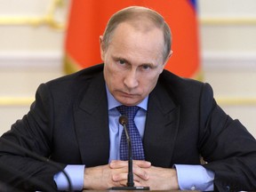 Russia's President Vladimir Putin chairs a cabinet meeting in July 30, 2014, around two weeks after Malaysia Airlines flight MH-17 was shot down over Ukraine.