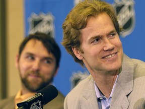 Chris Pronger, right, and Dwayne Roloson of the Edmonton Oilers share a laugh during an NHL Stanley Cup media availability at the Marriott Crabtree hotel in this file photo from June 4, 2006, in Raleigh, N.C.