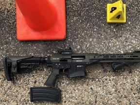 A semi-automatic, tactical-style shotgun was recovered from the scene after a shooting between RCMP and a man on the Queen Elizabeth II Highway left one person dead and an officer injured on May 6, 2020. ASIRT is investigating.