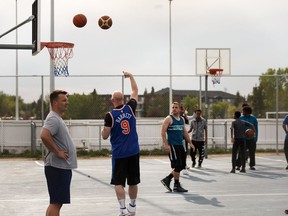 Basketball players take to the courts at Blue Quill Community League in Edmonton, on Thursday, May 28, 2020. Blue Quill and Florence Hallock basketball courts and Castledowns and McKernan skateparks will be closed from Saturday morning to Sunday evening after public complaints and observations of violations by City enforcement officers. Photo by Ian Kucerak/Postmedia