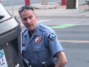 This still image taken from a May 25, 2020, video courtesy of Darnella Frazier via Facebook, shows a Minneapolis, Minnesota, police officer arresting George Floyd.