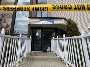 Police tape blocks the smashed front entrance to the Callingwood On 170th Apartments, 17004 64 Avenue, in Edmonton Thursday May 14, 2020. The Alberta Serious Incident Response Team (ASIRT) is investigating after a man sustained life-threatening injuries after he jumped or fell from a fourth floor balcony during an arrest by Edmonton police at the Callingwood On 170th Apartments.