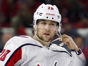 Washington Capitals forward Brendan Leipsic prepares for a face-off against the Carolina Hurricanes during the first period of an NHL hockey game in Raleigh, N.C. The Washington Capitals have placed Brendan Leipsic on unconditional waivers to terminate his contract after he made disparaging comments about women and teammates in a private social media chat.