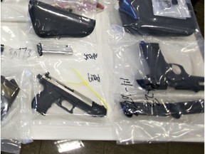 Some of the weapons that were seized from alleged members of the Warlocks Motorcycle Club were displayed at ALERT headquarters in Edmonton on March 27, 2014. A total of eight people were arrested.
