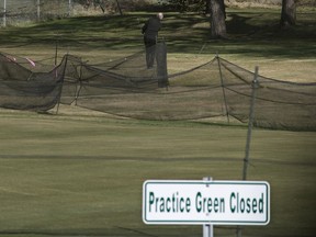 A golfer sneaks in a few practice swings at the Victoria Golf Course in Edmonton on Friday, May 1, 2020. Golf courses will be allowed to open May 2 as Alberta begins to relax some COVID-19 restrictions.