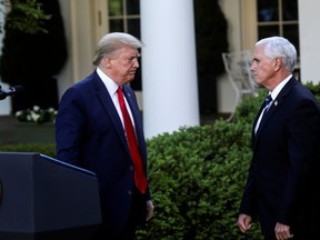 U.S. President Donald Trump turns to Vice President Mike Pence as they depart following a coronavirus response news conference in the Rose Garden at the White House in Washington, U.S., April 27, 2020.
