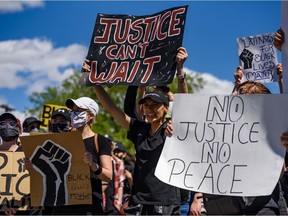 Thousands of people gathered in Calgary's Poppy Plaza to protest against racism and police brutality on Wednesday, June 3, 2020. The global protests were ignited after the death of George Floyd, who was killed by the police in Minneapolis.