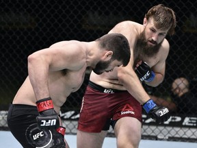 Tanner Boser, right, punches Philipe Lins of Brazil in their heavyweight fight during the UFC Fight Night event at UFC APEX on June 27, 2020 in Las Vegas, Nevada.