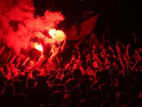 Soccer fans celebrate at Anfield Stadium as Liverpool FC win the Premier League title after Chelsea beat Manchester City tonight ensuring Liverpool FC can no longer be overtaken on points on June 25, 2020 in Liverpool, England.