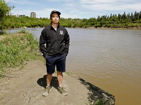 Michael Reyes, director of marketing at the Edmonton Dragon Boat Racing Club, at the club's docking and landing area on the bank of the North Saskatchewan River in Edmonton on Monday, June 1, 2020.