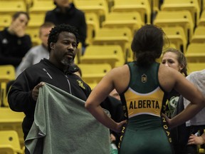 University of Alberta Golden Bears and Pandas wrestling head coach Owen Dawkins instructs one of his student-athletes during the 2019 Golden Bear Invitational at the Universiade Pavilion on Jan. 12, 2019.