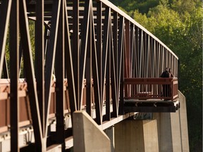 Families congregate on the Ainsworth Dyer Bridge at Rundle Park in Edmonton, on Friday, May 29, 2020.