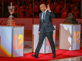Hockey fans honour longtime Calgary Flames captain, Jarome Iginla, the team's all-time leader in points and games played, by retiring his No. 12 jersey in Calgary on March 2, 2019.