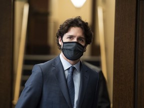 Prime Minister Justin Trudeau heads into the House of Commons at West Block on Parliament Hill in Ottawa, on Tuesday, June 2, 2020.