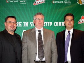 Cutline: Gary Gelinas, right, introduces Garry Davidson, centre, as the new general manager of the Everett Silvertips in Everett, Wash., along with assistant general manager Zoran Rajcic, left, on Feb. 15, 2012.