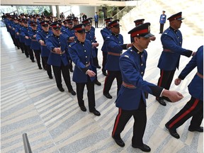 Edmonton police officers with Recruit Training Class 137 march during their 2017 graduation.