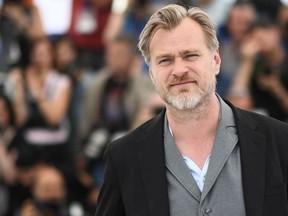 In this file photo taken on May 12, 2018 British director Christopher Nolan poses on May 12, 2018 during a photocall in Cannes.