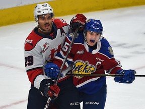 Edmonton Oil Kings Scott Atkinson (15) and Lethbridge Hurricanes defenceman Koletrane Wilson (29) battle in front of the net during WHL action at Rogers Place in Edmonton, September 29, 2019.