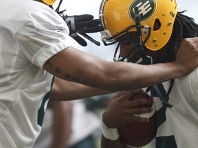 Slotback Fred Stamps works through a drill on the first day of his last Edmonton Eskimos training camp in the field house at Commonwealth Stadium on June 1, 2014.