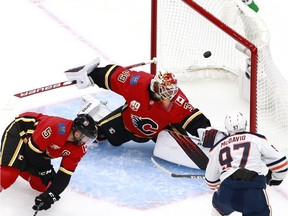 Oilers captain Connor McDavid scores his first of two goals Tuesday in Edmonton's 4-1 exhibition victory over the Calgary Flames.