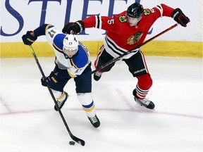 Jaden Schwartz of the St. Louis Blues skates against Connor Murphy of the Chicago Blackhawks during the second period in an exhibition game prior to the 2020 NHL Stanley Cup Playoffs at Rogers Place on July 29, 2020.
