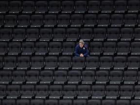Edmonton Oilers head coach Dave Tippett watches a scrimmage from the empty stands of Rogers Place on July 13, 2020.