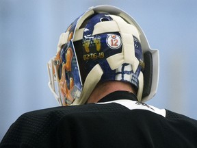 A No. 12 sticker is visible on Edmonton Oilers goaltender Mikko Koskinen's helmet in honour of former teammate Colby Cave during a training camp scrimmage in Edmonton on Wednesday, July 22, 2020.