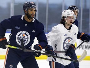 Darnell Nurse (25) and Kailer Yamamoto (56) take part in an Edmonton Oilers training camp scrimmage in Edmonton on Wednesday July 22, 2020.