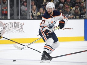 Defenceman Mike Green of the Edmonton Oilers skates with the puck against the Vegas Golden Knights in the third period of their game at T-Mobile Arena on February 26, 2020 in Las Vegas, Nevada.