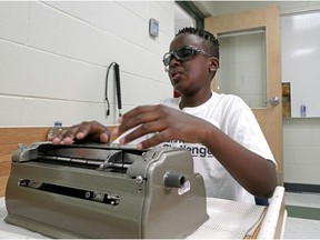 Louis St. Laurent Catholic School student Steve Kiema, 12, prepares to compete in the 2020 Braille Finals Challenge, a national Braille reading and writing competition, at his school on Thursday July 9, 2020.