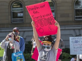 A few hundred people rallied at the Alberta legislature against the UCP education cuts on Tuesday, July 14, 2020.