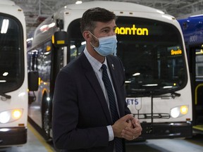 Mayor Don Iveson wears a mask during an announcement on the launch of the city's first batch of electric buses last week at the Kathleen Andrews Transit Garage.