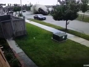 CCTV footage captured a red car careening into a Brampton residential neighbourhood on Wednesday. A man in his 20s walked away without injuries, despite the shocking crash. Peel Regional Police says he's been charged with dangerous driving.