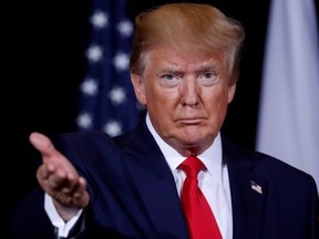 U.S. President Donald Trump gestures towards reporters during a bilateral meeting with Japan's Prime Minister Shinzo Abe on the sidelines of the 74th session of the United Nations General Assembly in New York City, Sept. 25, 2019.