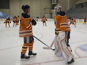Edmonton Oilers Matt Benning and Mikko Koskinen take part in a scrimmage to pay tribute to teammate Colby Cave on Saturday, July 25, 2020 in Edmonton.