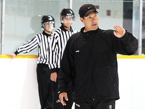 NHL vice-president and director of officiating Stephen Walkom holds on-ice session with minor hockey officials in this file photo from Aug. 11, 2012.