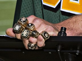 Tanner Stevenson, son of former Eskimo player Bill Stevenson, wears all seven Grey Cup rings that his father won during his career in this file photo from Oct. 13, 2014.
