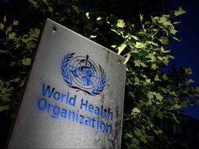 A photo taken in the late hours of May 29, 2020 shows a sign of the World Health Organization at their headquarters in Geneva amid the COVID-19 outbreak.