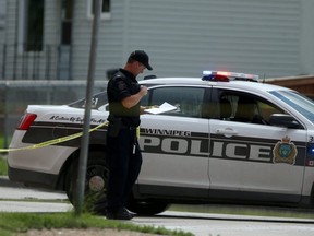 Police investigate a death in Winnipeg on Wednesday, July 1, 2020.